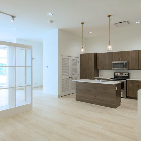 Spacious kitchen with natural light and stainless steel appliances in Wilmington apartment