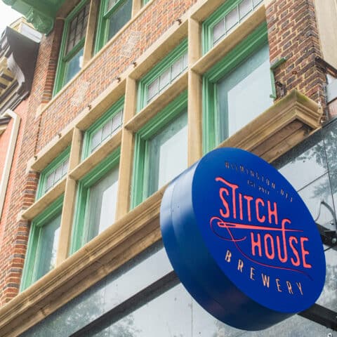 829 MKt apartment exterior with Stitch House Brewery sign
